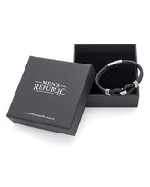 Black braided bracelet in a 'Men's Republic' box on a white background